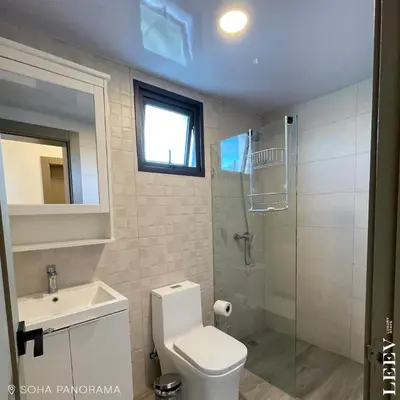 a bathroom with a toilet and a sink and a shower at Soha panorama- A14- 2 dormitorios in Santiago de los Caballeros