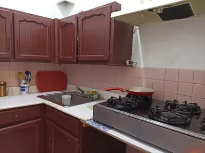 a kitchen with a stove with a pot on it at La casa de Isabel y Juan, Zona Colonial in Santo Domingo