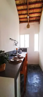 a kitchen with a large counter top in a room at Kite House Cabarete across Kite Beach in Cabarete