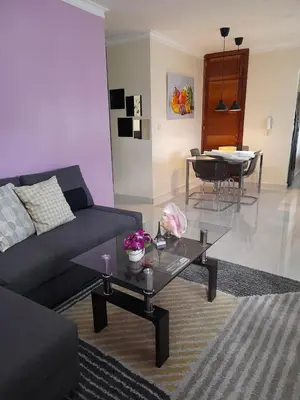 a living room with a couch and a table at Apartamento Esme in Santo Domingo
