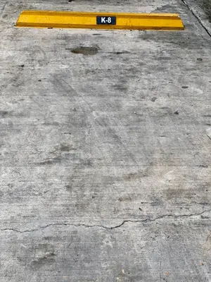 a yellow bench sitting on top of a sidewalk at Apartamento Esme in Santo Domingo