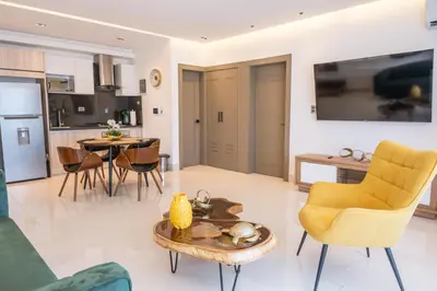 a living room with a couch and a table at Top Floor in Luxury Tower in Santiago de los Caballeros