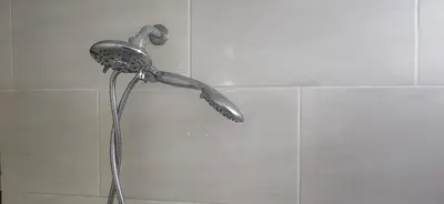 a shower in a bathroom with a shower head at Full size 2 bedrooom 2 bath condo split in Sosúa