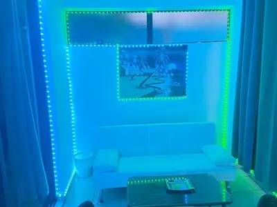 a living room with blue lights and a couch at Full size 2 bedrooom 2 bath condo split in Sosúa