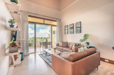 a living room with a couch and a table at Wonderful Apt at Casa de Campo in El Infiernito
