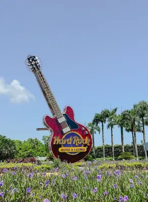 a giant guitar statue in a field of flowers at Unique 1BDR Retreat with pool at Hard Rock Golf C. in Punta Cana