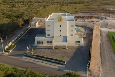 an aerial view of a large white building at Super 8 by Wyndham Manzanillo in Pepillo Salcedo
