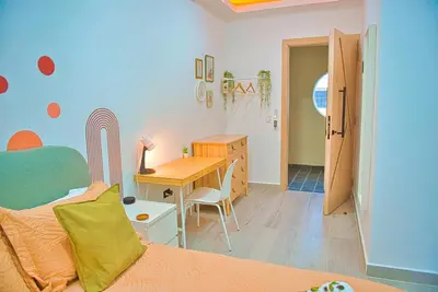 a bedroom with a desk and a bed and a desk at Marina Bay in Las Terrenas
