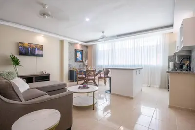 a living room with a couch and a table at Suite 10 en la Zona Colonial in Santo Domingo