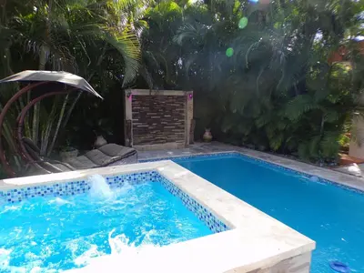 a swimming pool in a yard with a swimming pool at Casa Linda beautiful Villa in Sosúa