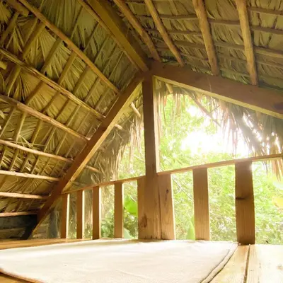 a room with a large window in a wooden building at Casita de Madera Encuentro in Bombita