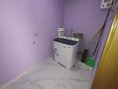 a small room with a small refrigerator in the corner at Apartamento amueblado Res Blue Amber, 1 habitación in Santiago de los Caballeros