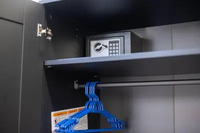 a blue plastic hose hanging from a microwave oven at Cozy Suite 8 en la Zona Colonial in Santo Domingo