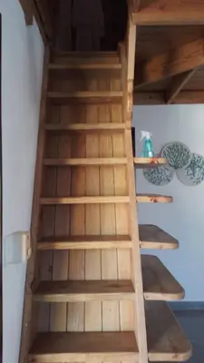 a set of wooden stairs in a room at Playa Bonita 4 minute walk from our private Villa Anantara Bonita in Las Terrenas