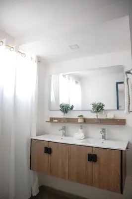 a bathroom with a sink and a mirror at Salt Air & City Vibe Awaits! Just Minutes to Beach in San Felipe de Puerto Plata