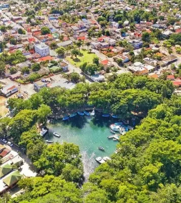 an aerial view of a river with boats in the water at Margarita in Río San Juan
