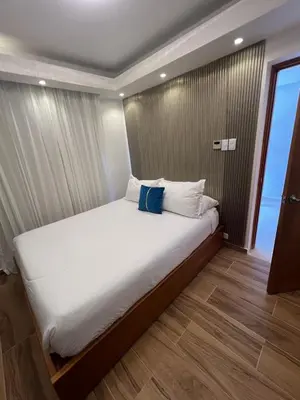 a large bed in a room with a window at Samaná Suites Hotel by Habita in Santa Bárbara de Samaná