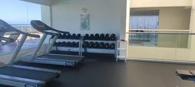 a gym with two tread machines and a large window at Lincoln Suite Pool - Gym - Sauna in Santo Domingo