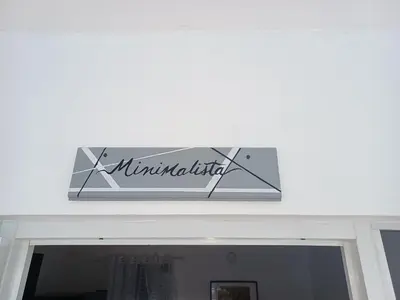 a sign on top of the door of a building at Doña Mayra Aparta Hotel in Las Terrenas