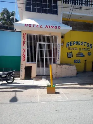 a hotel nimaoco sign on the side of a building at Hotel Ningo in Santa Bárbara de Samaná