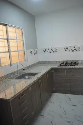 a kitchen with a sink and a counter top at Apartamento Amueblado Caribe, Santo Domingo a 10 minutos del Aeropuerto Internacional de las Americas in Santo Domingo