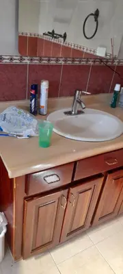 a bathroom counter with a sink and a sink at Villa Isabel, NO SMOKING, cerca embajada USA in Santo Domingo