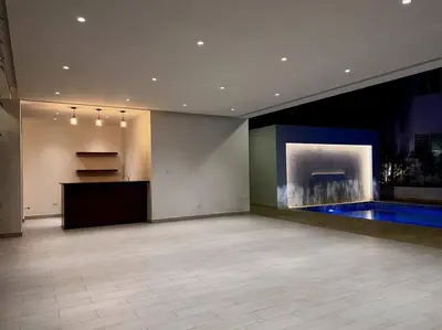 a large empty room with a large painting on the wall at Outstanding Pent House w/Jacuzzi in Santiago de los Caballeros