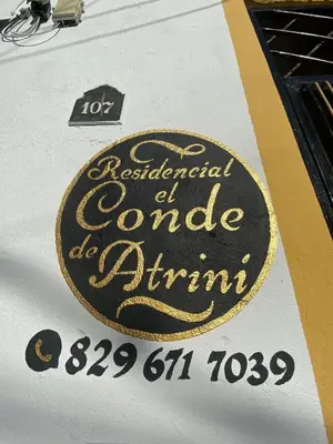 a close up of a sign on a table at El Conde De Atrini in Santo Domingo