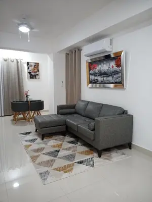 a living room with a couch and a table at The most comfortable apartment in Boca Chica in Boca Chica