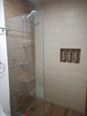 a shower with a glass door in a bathroom at The most comfortable apartment in Boca Chica in Boca Chica