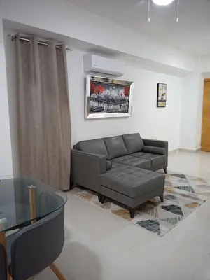 a living room with a couch and a glass table at The most comfortable apartment in Boca Chica in Boca Chica