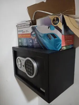 a black microwave with a box on top of it at The most comfortable apartment in Boca Chica in Boca Chica