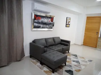 a living room with a couch and a chair at The most comfortable apartment in Boca Chica in Boca Chica