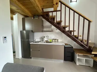 a kitchen with a sink and a refrigerator at Esprit Caribbean Bayahibe in Bayahibe