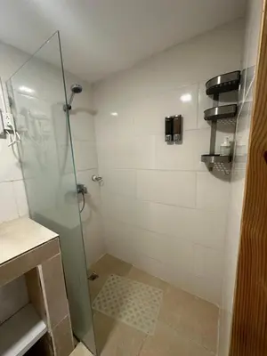 a bathroom with a shower with a glass door at Noe Hotel Punta Cana in Punta Cana