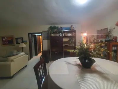 a living room with a table with a plant on it at Dominican Art 2 Bedroom condo El Cortecito in Punta Cana