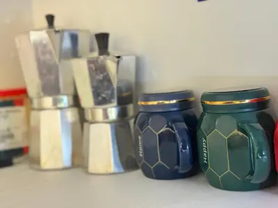 a group of vases sitting on a counter at Moderno Penthouse in Solorín