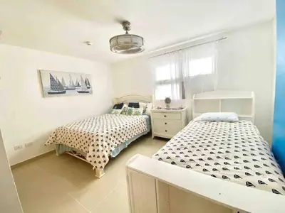 a bedroom with two beds and a window at 3 Bedrooms At Marbella Beachfront Juan Dolio no820 in Juan Dolio