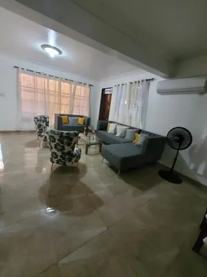 a living room with couches and chairs in a room at Departamento Rosa in Santo Domingo