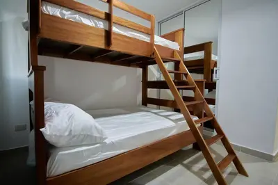 a couple of bunk beds in a room at The apartment you dreamed of 1 in Santiago de los Caballeros