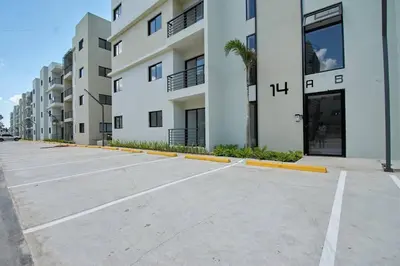 an empty parking lot in front of a building at The apartment you dreamed of 2 ! in Santiago de los Caballeros