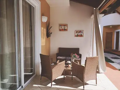 a room with a table and chairs and a bedroom at Esmeralda67 Tamarindo in Bayahibe