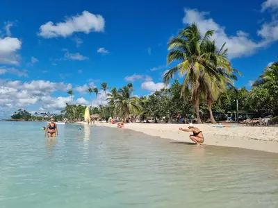 a group of people playing in the water on a beach at Esmeralda67 Tamarindo in Bayahibe