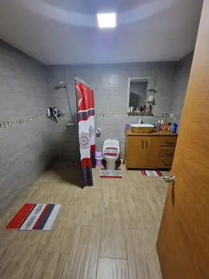 a bathroom with a toilet and a sink at Villa vacacional Rikheriluz in La Romana
