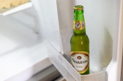 a green bottle of beer sitting in a refrigerator at Río Mar Cumayasa in La Romana
