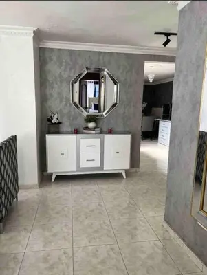 a room with a white dresser and a mirror at Malecon View, Zona Colonial in Santo Domingo