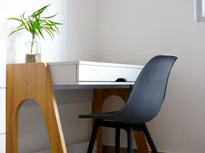 a desk with a black chair and a white drawer at Dreams Room Soha II in Santiago de los Caballeros