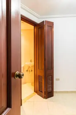 an open door to a bathroom with a toilet at Gateway For You And Your Loves Ones I Sleeps 6 in Santo Domingo