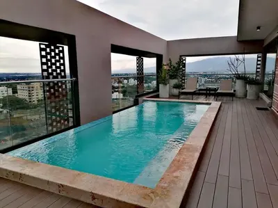 a large swimming pool on top of a building at Paradise Room Rialto Residences in Santiago de los Caballeros