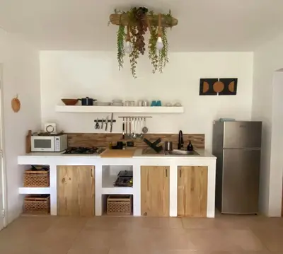 a kitchen with a sink and a refrigerator at Xarraca, excepcional apartamento in Bayahibe